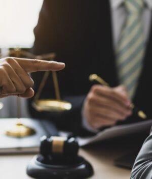 Landlord and tenant having a discussion over a contract to resolve tenant disputes in Canada.