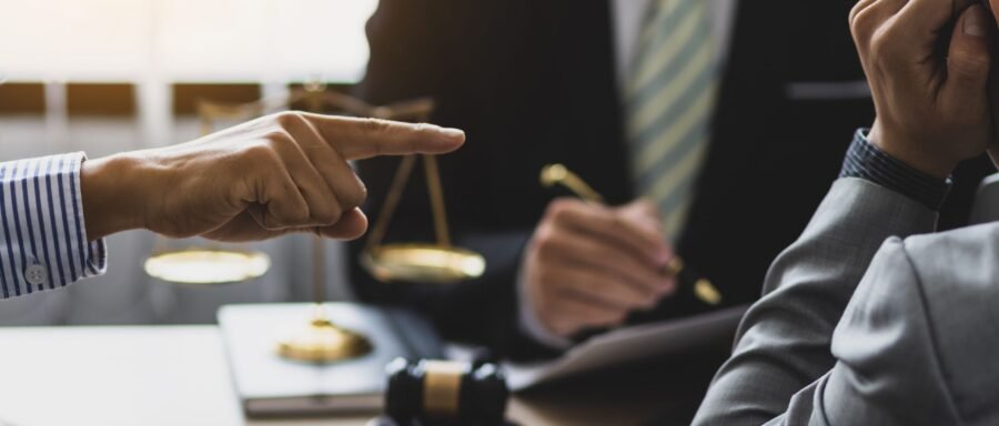Landlord and tenant having a discussion over a contract to resolve tenant disputes in Canada.
