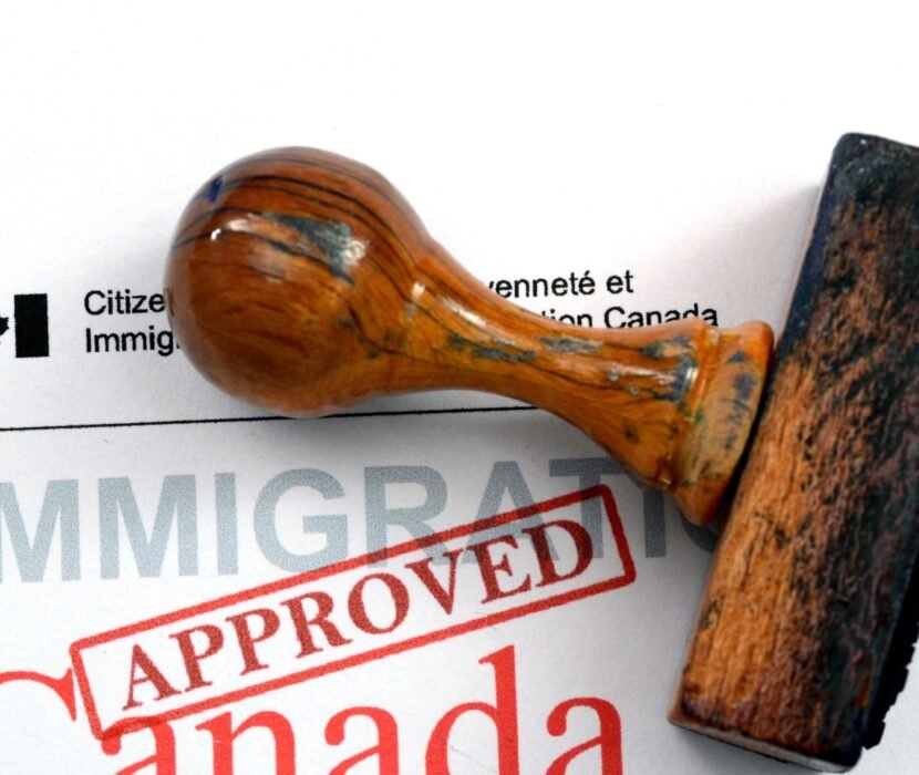 business visa lawyer Regina reviewing Canadian business visitor documents