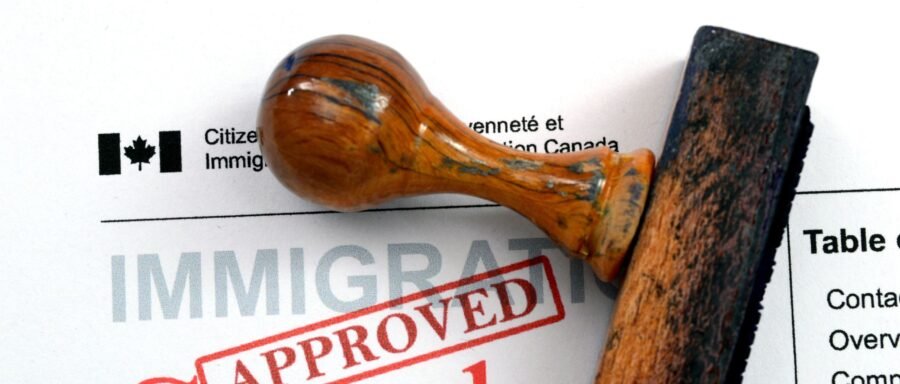 business-visa business visa lawyer Regina reviewing Canadian business visitor documents