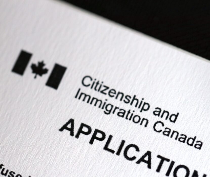 citizenship application lawyer Regina reviewing Canadian citizenship documents
