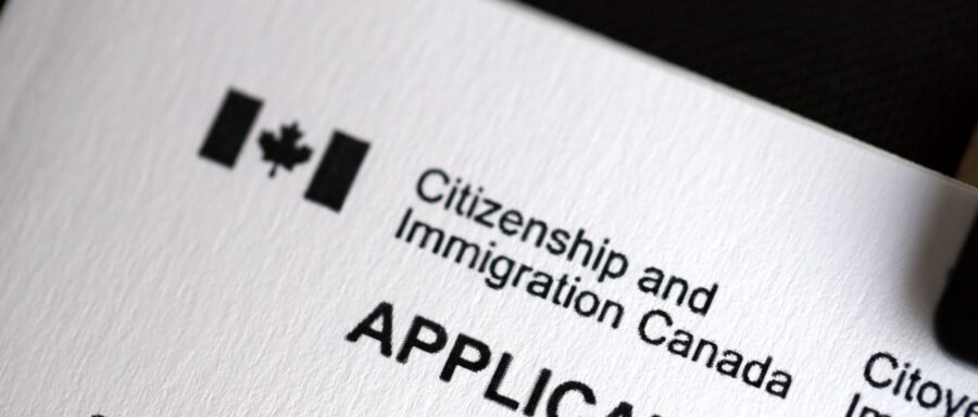 citizenship-application citizenship application lawyer Regina reviewing Canadian citizenship documents