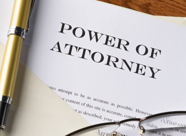 power of attorney lawyer Regina reviewing legal authorization documents