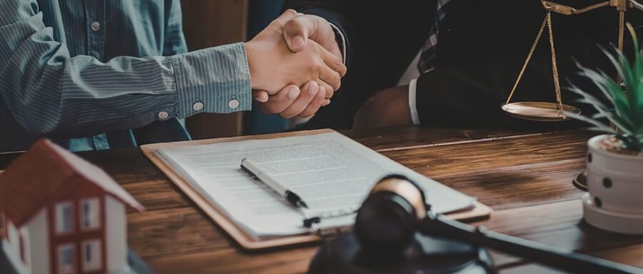 real estate lawyer Regina reviewing home purchase closing documents