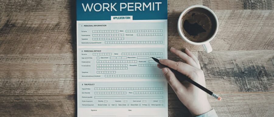 spousal work permit lawyer Regina reviewing Canadian work authorization documents